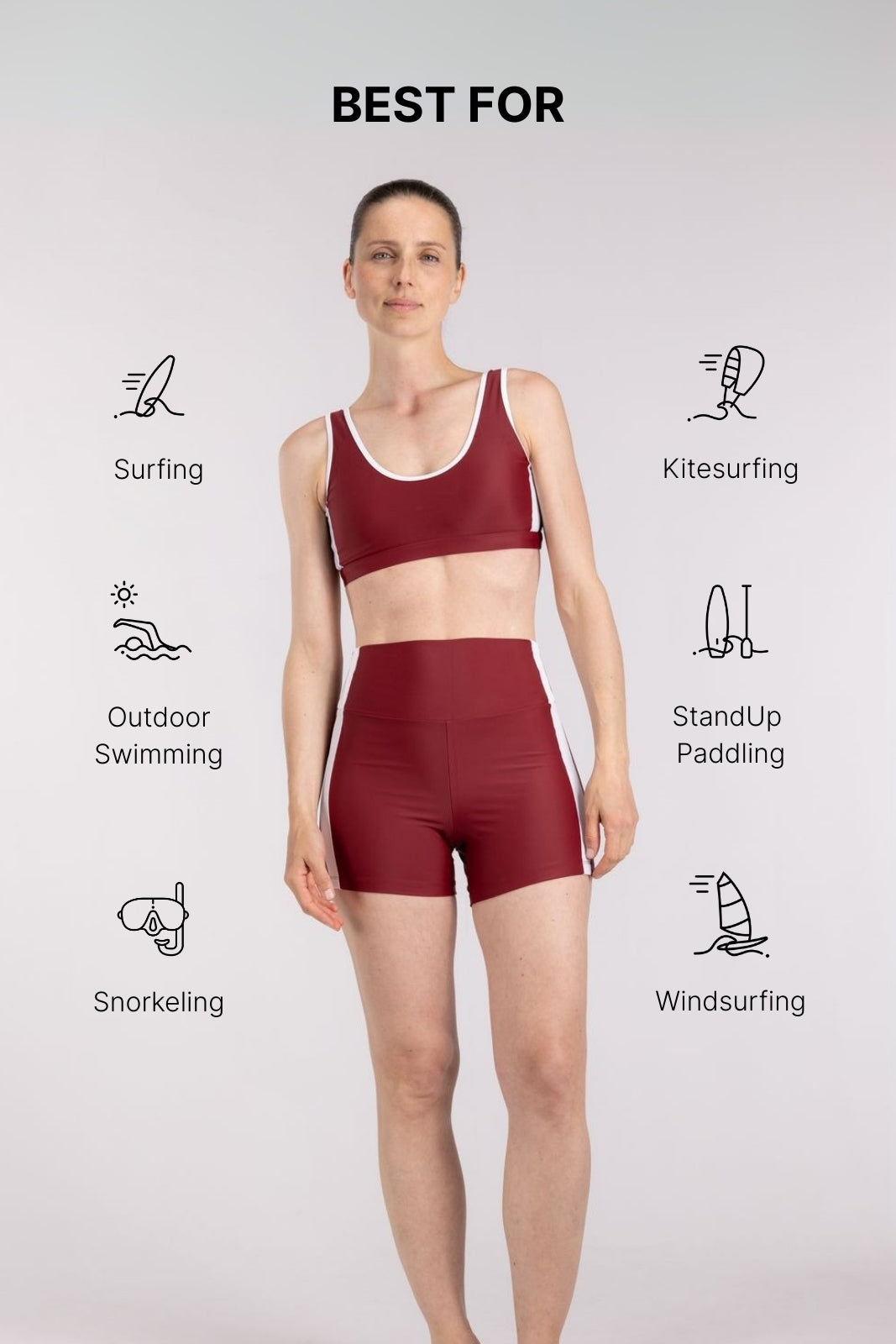 Athlete in red and white WALLIEN sports top and shorts standing relaxed, ready for training, on a white studio background