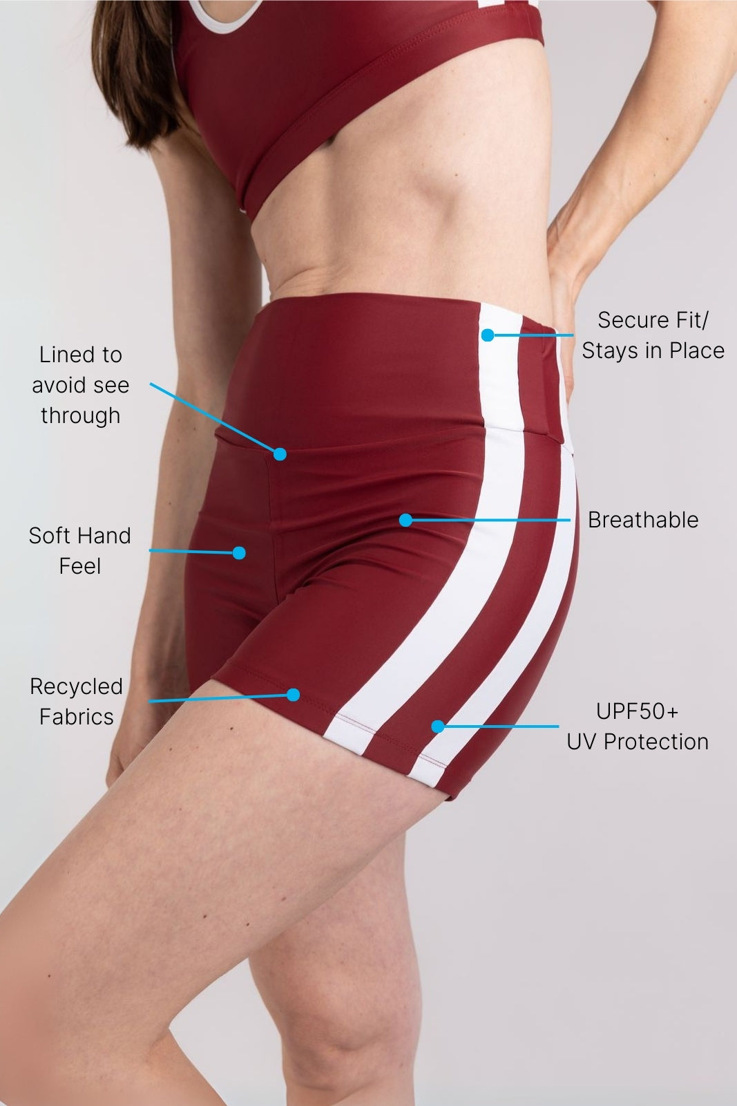 Side view of red and white stripe WALLIEN sports shorts showing fit and detail, styled for performance, on studio background