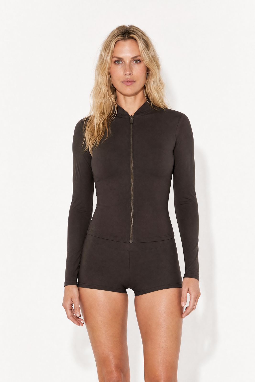 Coffee brown rash guard with full-length zip and long sleeves, ideal for women’s surfwear, on a white background