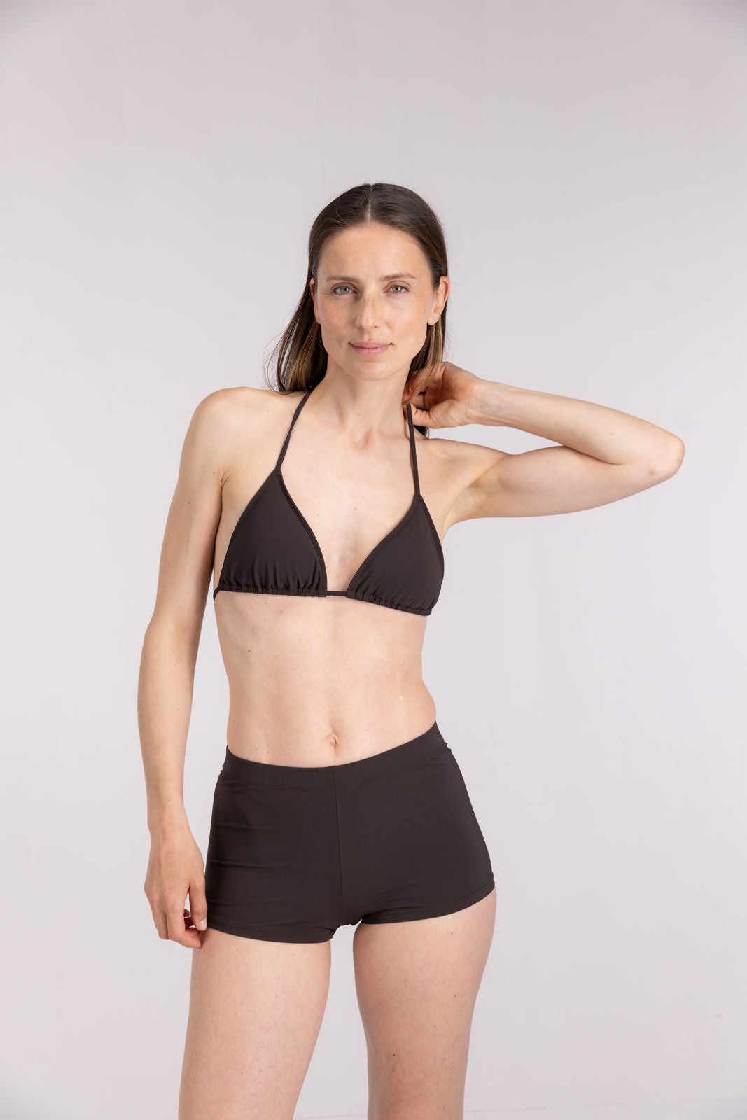 Eco-conscious swimwear look with WALLIEN triangle bikini top in coffee brown for active beach days, clean studio background