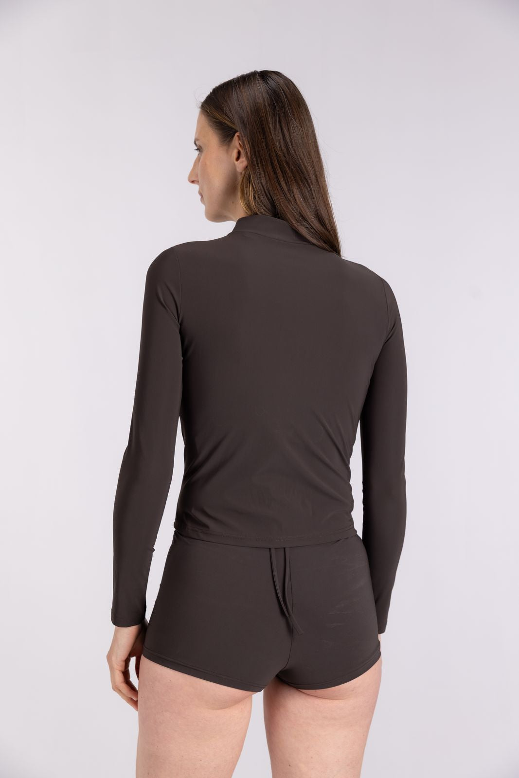 Back view of eco-friendly WALLIEN Coffee Rash Guard With Zip for surfing or SUP, seamless fit, flat seams, studio background