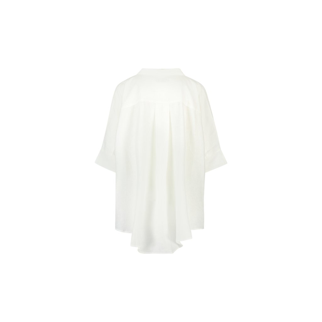 Back of off-white summer blouse with pleated detailing, soft texture and flowy hem, designed by WALLIEN on a white background